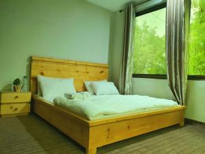 Ein Bett oder Betten in einem Zimmer der Unterkunft HIKK Inn