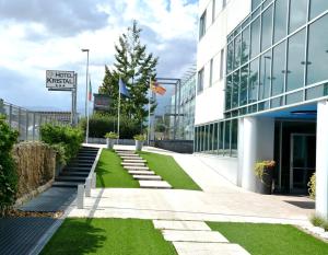 an external view of a building with green grass at Hotel Kristal 3 Stelle Superior in Zanè