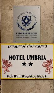 a sign for a hotel unisphere at Hotel Umbria in Perugia