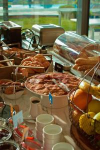 a table filled with lots of different types of food at Golden Tulip Porto-Vecchio in Porto-Vecchio