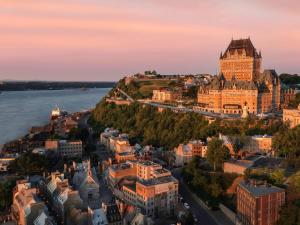 an aerial view of the city of geneva at sunset at Fairmont Le Chateau Frontenac in Quebec City
