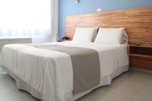 Cama ou camas em um quarto em Hotel Florinda