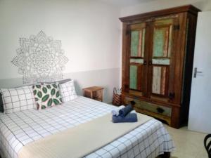 Ένα ή περισσότερα κρεβάτια σε δωμάτιο στο Apartamento Hibiscus Condomínio Village Praia Imbassai +50 φωτογραφίες