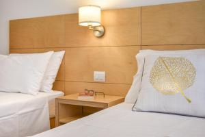 A bed or beds in a room at Ammarèa B&B