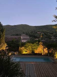 a view of a pool from the roof of a building at MAISON ST LAURENT in Olargues