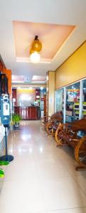 a lobby of a restaurant with a lot of chairs at B&J Guesthouse and Tours in Tagbilaran City