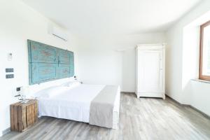 Postel nebo postele na pokoji v ubytování LA CORTE SUL LAGO