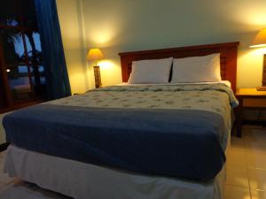 Postel nebo postele na pokoji v ubytování D' Kubu Pratama Homestay