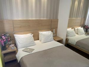 Postel nebo postele na pokoji v ubytování Laurus Motel Airport Tuzla