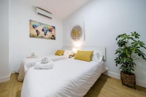 Posteľ alebo postele v izbe v ubytovaní MALAGUETA Beach & Sun