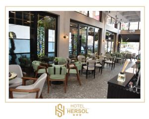 a restaurant with a bunch of chairs and tables at HOTEL HERSOL in Durrës