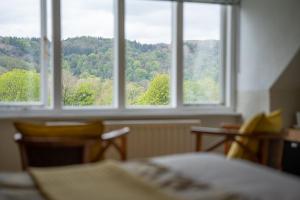 Llit o llits en una habitació de Brantholme Bed & Breakfast