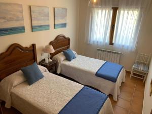 Postel nebo postele na pokoji v ubytování Los Olivos de José