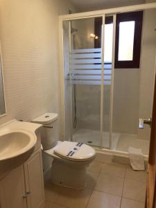 a bathroom with a shower and a toilet and a sink at La Cala Azul 2 bedroom apartment with big sunny terrace & walking distance to all the amenities - costa del sol in La Cala de Mijas