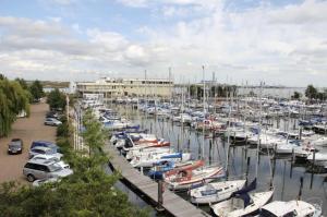 a bunch of boats parked in a marina at Strand Beach View House in Gillingham