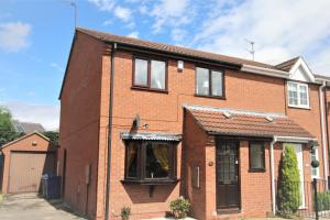 a red brick house with black windows at Doncaster - Thorne - Great Customer Feedback - 3 Bed Semi Detached House - Private Garden & Parking - Quiet Cul De Sac Location in Doncaster