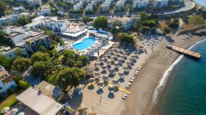 an aerial view of a beach with umbrellas and the ocean at CHARM BEACH HOTEL in Akyarlar