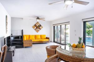 a living room with a couch and a table at Santorini Villas del Mar Santa Marta in Santa Marta