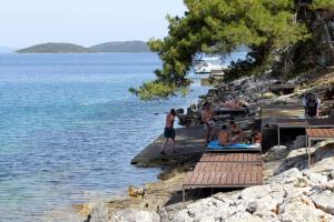 a group of people on a dock in the water at Apartments with WiFi Bozava, Dugi otok - 18916 in Božava