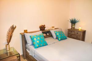 Posteľ alebo postele v izbe v ubytovaní PALM BEACH HOME