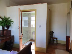 a room with a door and a chair and a table at The exchange buildings in Cork