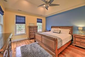 een slaapkamer met een bed en een plafondventilator bij Spacious Trenton Home with Pond on 20 Acres! in Trenton