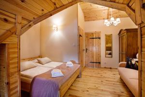 Posteľ alebo postele v izbe v ubytovaní Skansen Bicz Resort