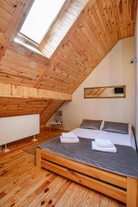 Posteľ alebo postele v izbe v ubytovaní Skansen Bicz Resort