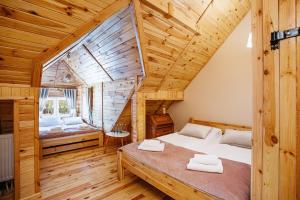 Posteľ alebo postele v izbe v ubytovaní Skansen Bicz Resort