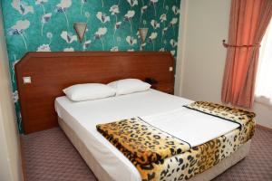 Кровать или кровати в номере Hotel Soydan