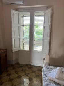 Letto o letti in una camera di Palazzo Porta