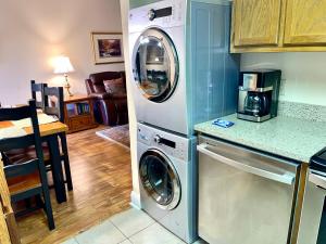 a kitchen with a washer and dryer in it at River Place Condos #204 2BD in Pigeon Forge