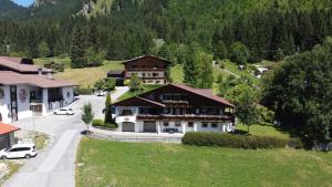 an aerial view of a house in a mountain at Haus Monika in Nesselwängle