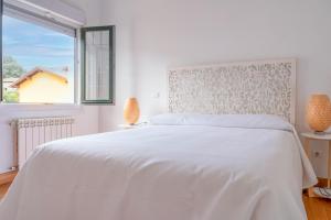 A bed or beds in a room at Fidalsa Majestic