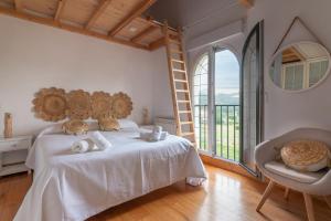 A bed or beds in a room at Fidalsa Majestic
