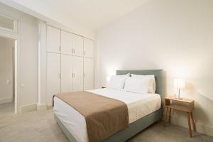 A bed or beds in a room at The H Experience - The Good Life Archanes - Free parking