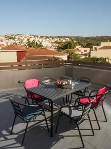 A balcony or terrace at The H Experience - The Good Life Archanes - Free parking
