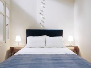 A bed or beds in a room at The H Experience - The Good Life Archanes - Free parking