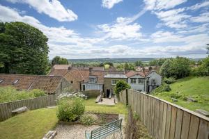 a view from the garden of a home with a fence at Fairview in Ampleforth