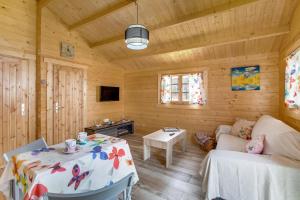 a living room with a table and a couch at Finca Mariposa in Adeje