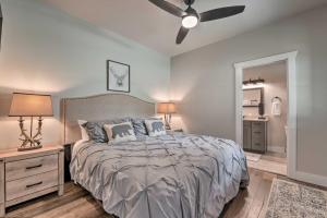 a bedroom with a bed and a ceiling fan at 7 Mi to Ski Sapphire Valley Cottage with Fire Pit in Glenville