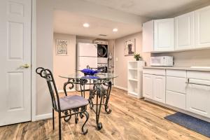 a kitchen with a table and chairs in a room at Bel Air Apartment with Pool about 2 Mi to Main St in Bel Air