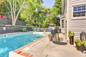 a swimming pool in the backyard of a house at Bel Air Apartment with Pool about 2 Mi to Main St in Bel Air