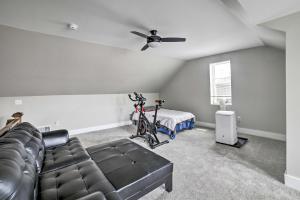 a living room with a couch and a bed at Well-Appointed Pittsburgh Home 1 Mi to Dtwn! in Pittsburgh