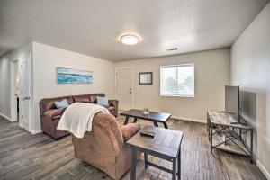 a living room with a couch and a tv at Welcoming Carlsbad Home Near Parks and Town! in Carlsbad