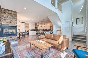 a living room with a couch and a table at Spacious Old Town North Home with Rooftop Deck! in Fort Collins