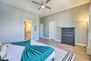 a bedroom with a bed and a ceiling fan at Spacious Old Town North Home with Rooftop Deck! in Fort Collins