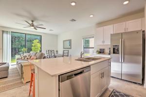a kitchen with a stainless steel refrigerator freezer at Brand New Fort Myers Townhome Community Pool in Fort Myers