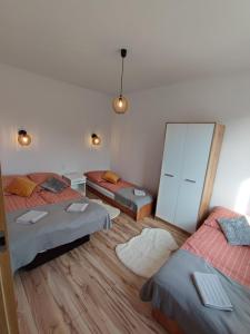 Tempat tidur dalam kamar di Apartament Domowe Zacisze