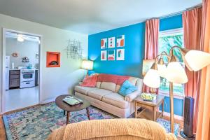 a living room with blue walls and a couch at Modern Rapid City Duplex Less Than 10 Mi to Natl Forest! in Rapid City